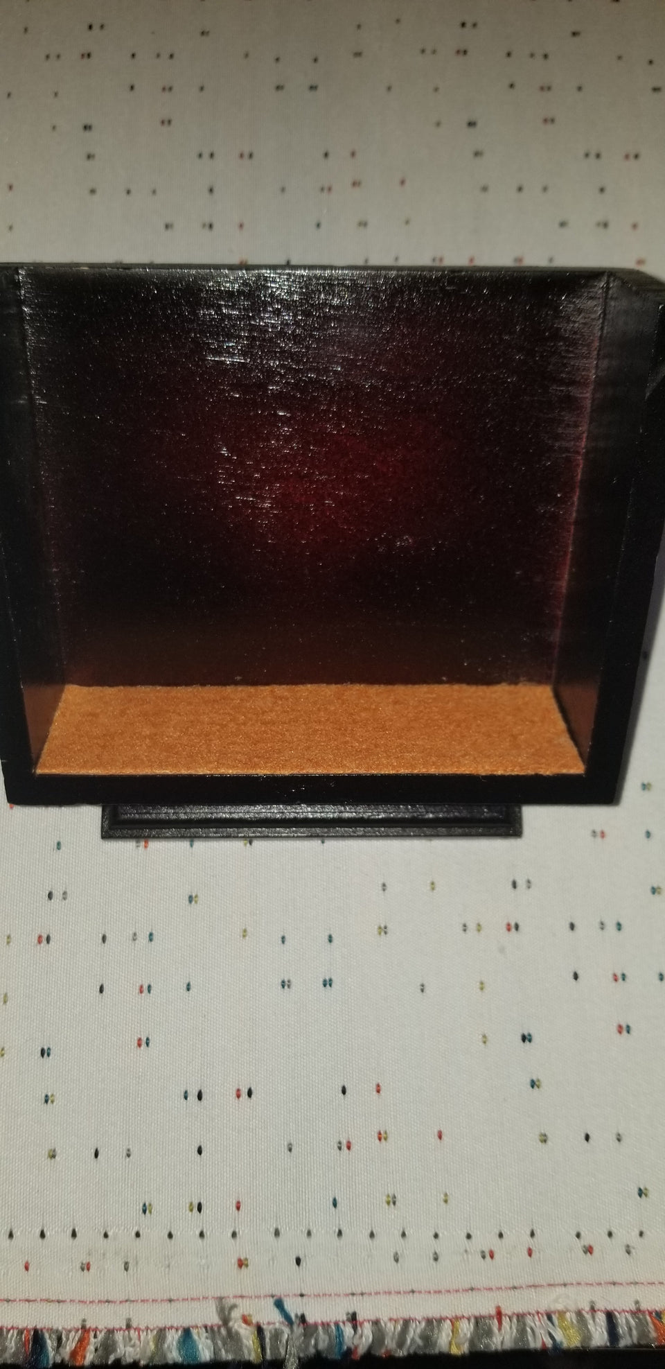 modern walnut pedestal coaster holder with orange felt lined bottom that match Carmine coasters