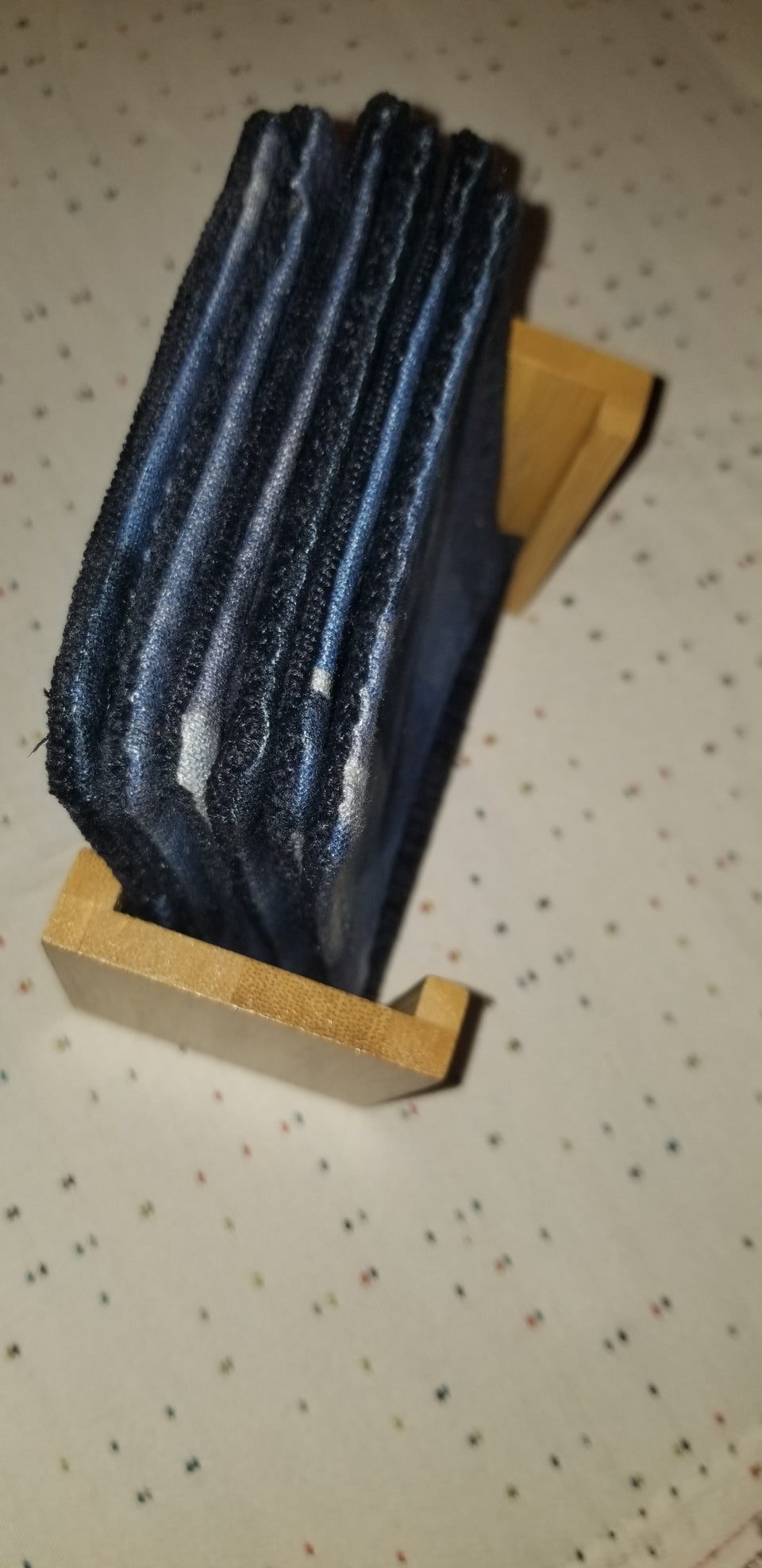 Modern bamboo upright coaster holder with blue velour lining with matching Chase coasters top view side.