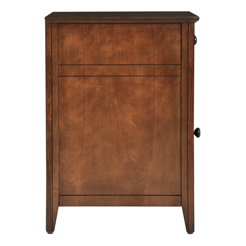 brook chestnut side table. Shutter style door and drawer with black knob. Side view.