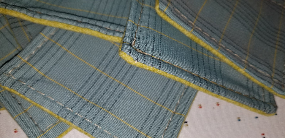 Charlie turquoise and lime green plaid stack of coasters detail.