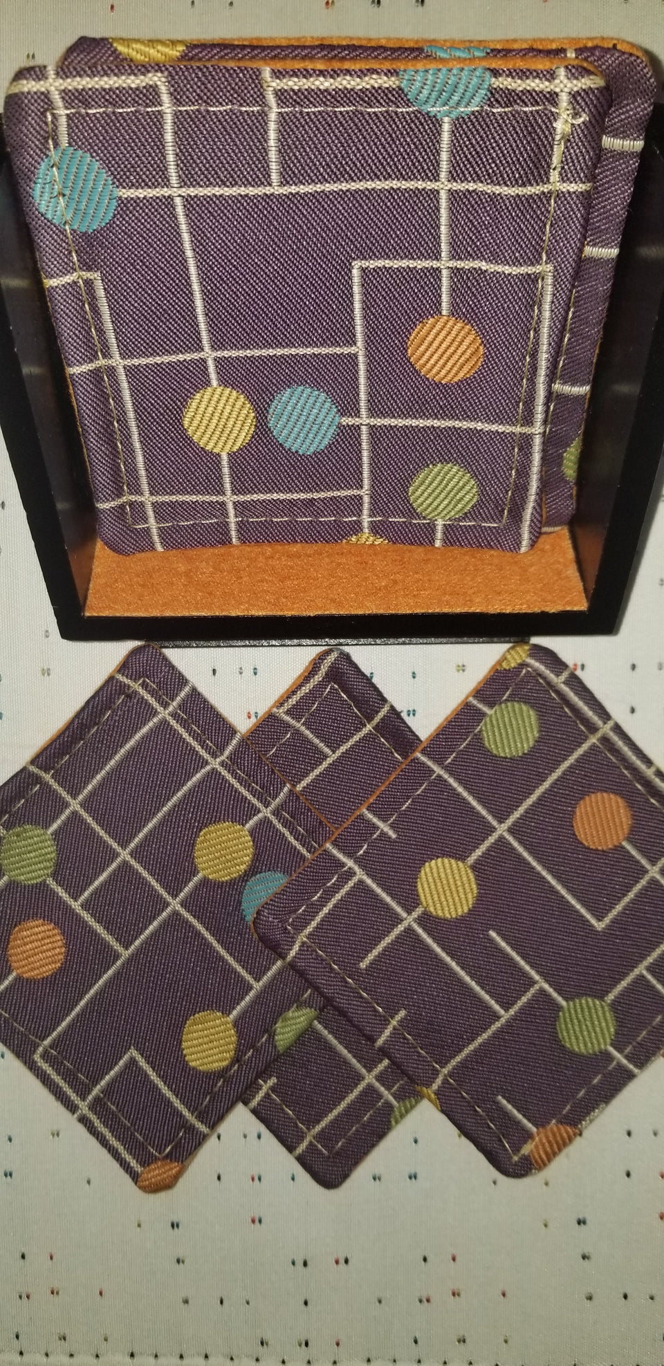 Carmine purple and orange coasters with Carla pedestal coaster holder set