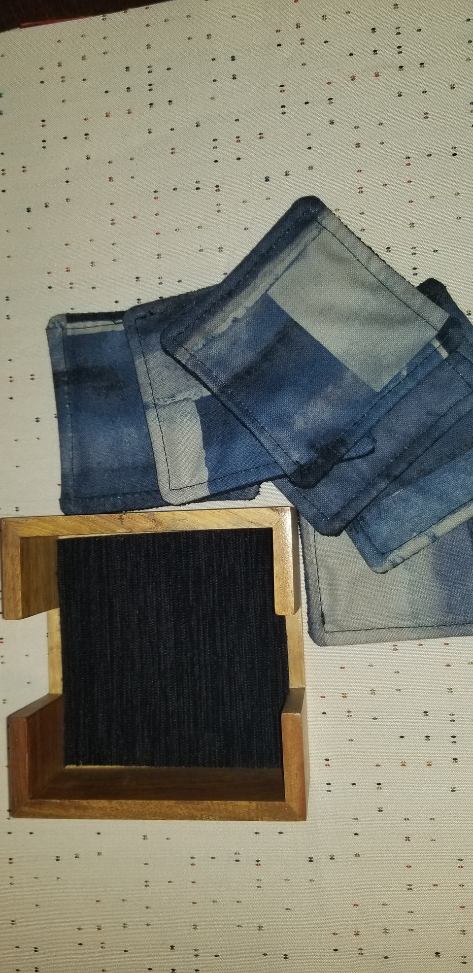 Modern square acacia wood coaster holder with blue velour lining and Chase blue and gray matching coasters.