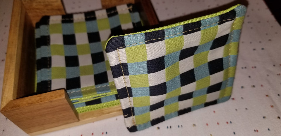 Set of (4) Chuck black, white, lime green, and turquoise gingham check patterned coasters with modern squared bamboo coaster holder Caroline. 