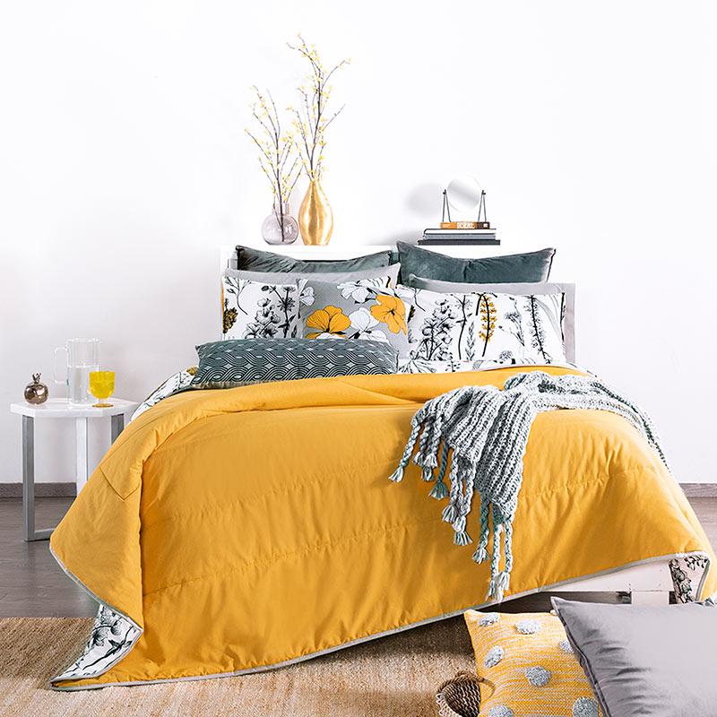 modern home bedroom decor with yellow, black, & white floral reversible comforter set front view