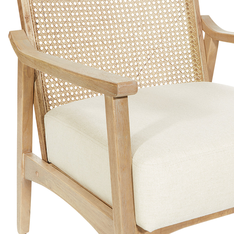 Rustic, solid wood frame, natural finish and deeply padded seating ensure a durability and comfort. The softly curved cane back provides visual interest and texture to distinguish your living room, family room or reading nook. detail