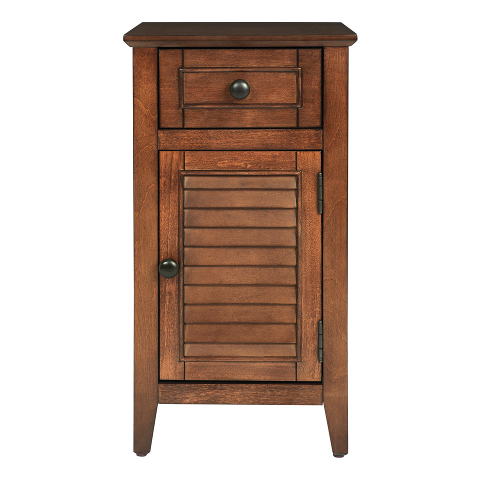 brook chestnut side table. Shutter style door and drawer with black knob. Front view. 