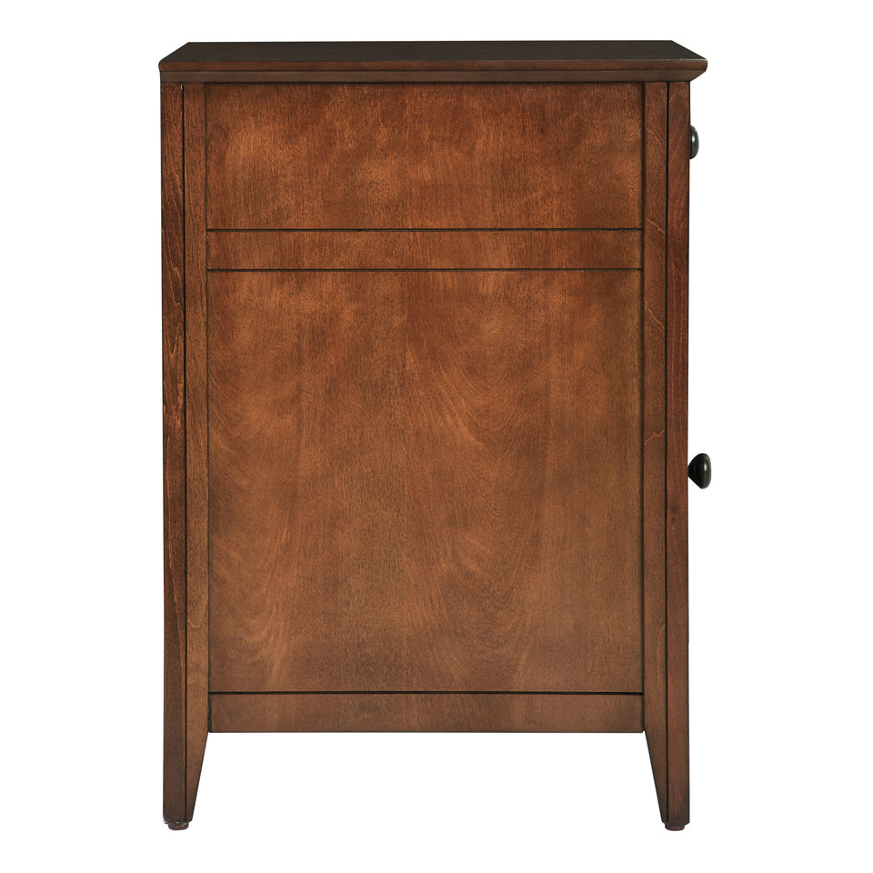 brook chestnut side table. Shutter style door and drawer with black knob. Side view. 