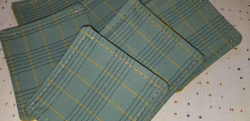 Charlie turquoise and lime green plaid stack of (6) coasters detail.