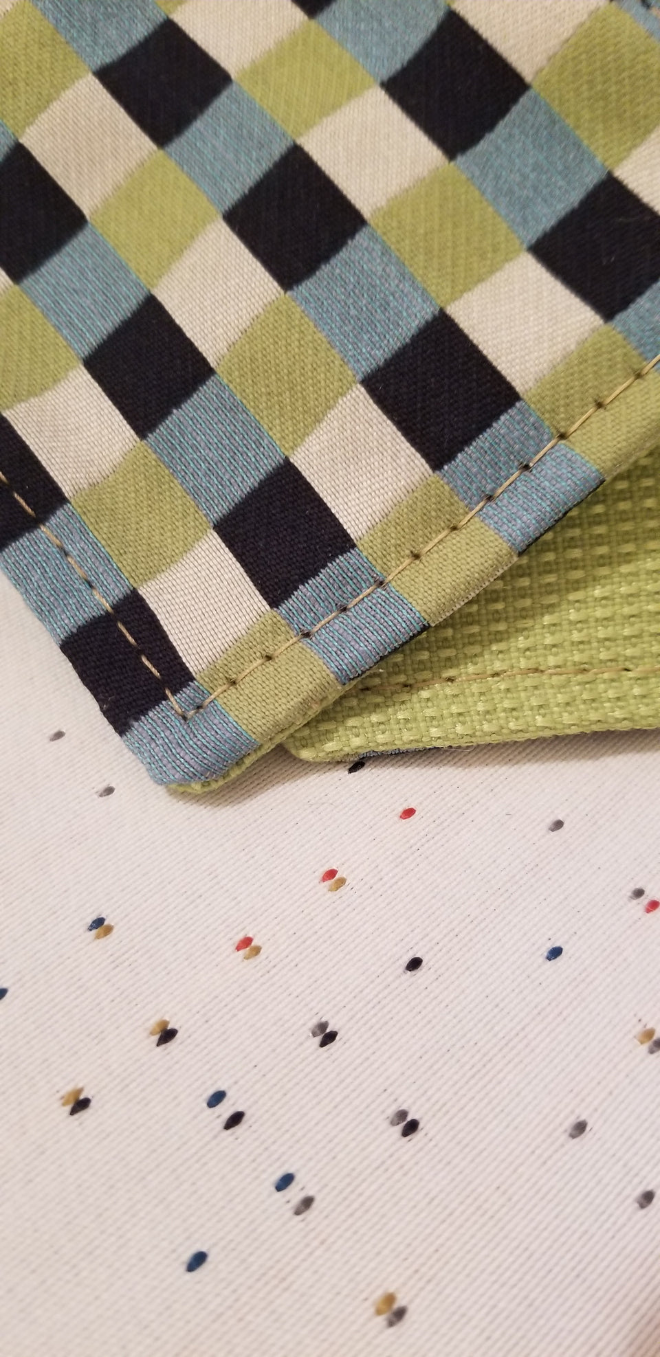 Chuck black, white, lime green, and turquoise gingham check patterned coasters detail view. 